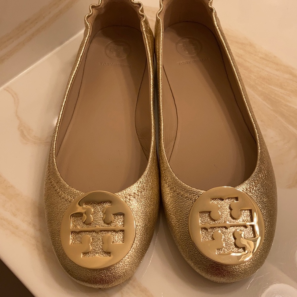 New golden Tory Burch flats with gold logo